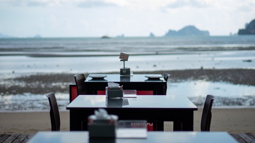 Beachfront tables overlooking the bay at Branch 2