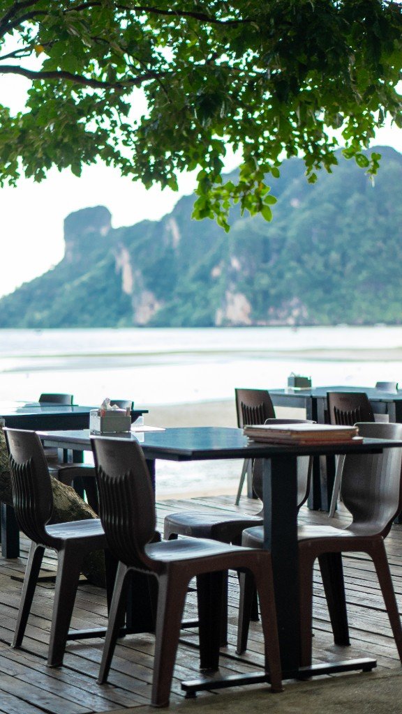 Dining tables facing the ocean and mountain at Branch 2